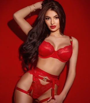 Playmate Devon is looking ready to have fun in this escort image