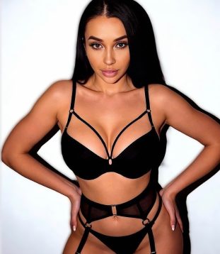 Havana captivates with her charming pose and radiant eyes that invite you closer.