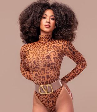 Jade captivates you with her charming stance and warm, welcoming eyes.